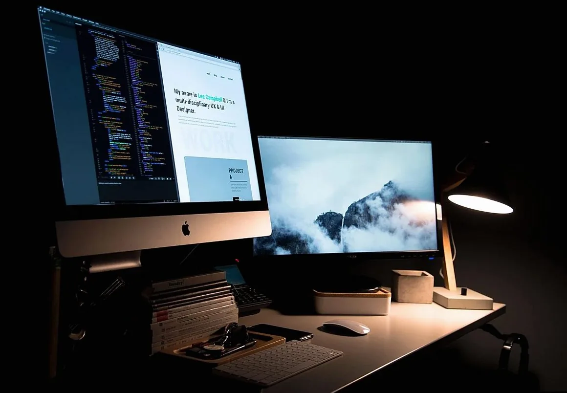 apple, books, computers, desk, desktop, keyboard, lamp, mac, work space, black computer, black book, black laptop, black